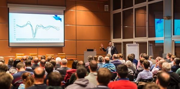 man speaking at conference _ cropped